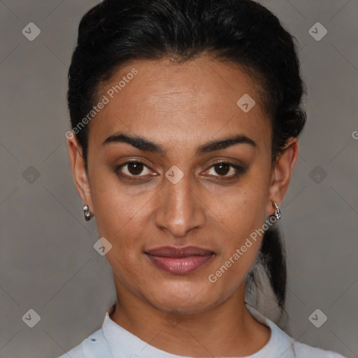 Joyful latino young-adult female with short  black hair and brown eyes