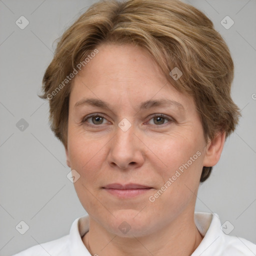 Joyful white adult female with short  brown hair and grey eyes