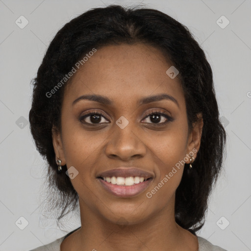 Joyful black young-adult female with medium  brown hair and brown eyes