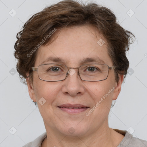 Joyful white adult female with short  brown hair and grey eyes