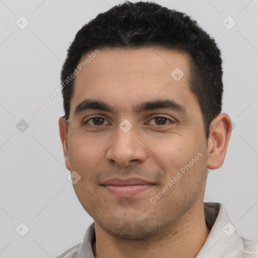 Joyful latino young-adult male with short  black hair and brown eyes