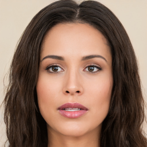 Joyful white young-adult female with long  brown hair and brown eyes