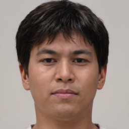 Neutral asian young-adult male with short  brown hair and brown eyes