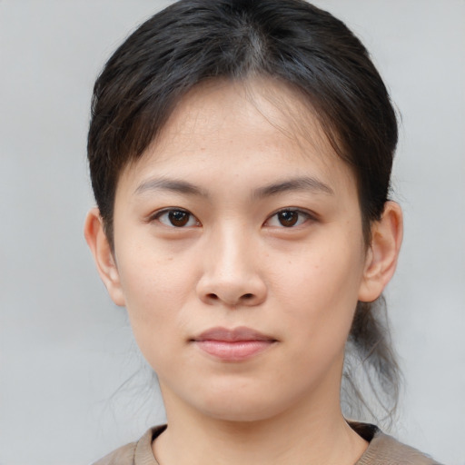 Neutral asian young-adult female with short  brown hair and brown eyes