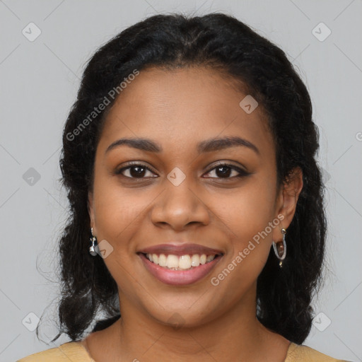 Joyful black young-adult female with long  brown hair and brown eyes