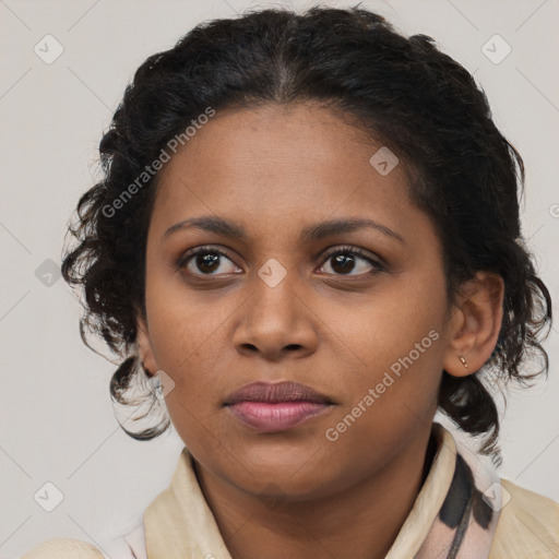 Joyful black young-adult female with medium  brown hair and brown eyes