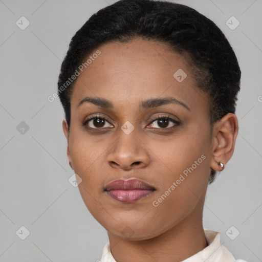 Joyful black young-adult female with short  black hair and brown eyes