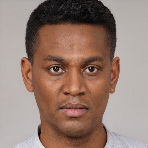 Neutral latino young-adult male with short  brown hair and brown eyes