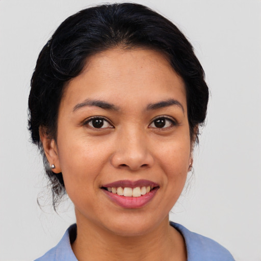Joyful asian young-adult female with medium  black hair and brown eyes