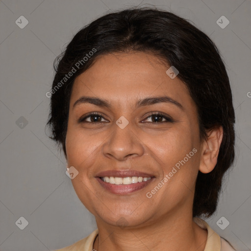 Joyful latino young-adult female with medium  brown hair and brown eyes