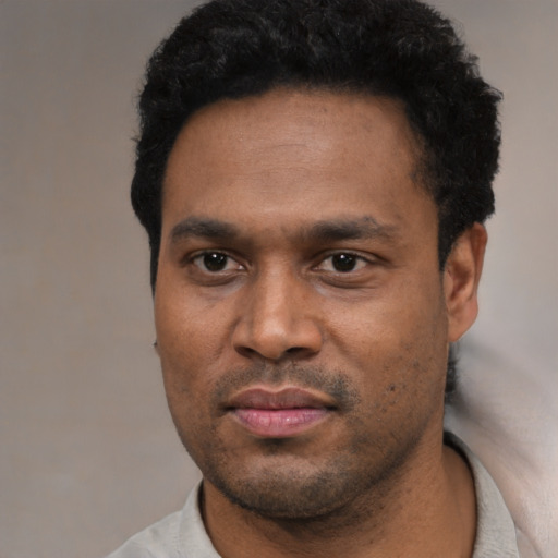 Neutral black young-adult male with short  black hair and brown eyes