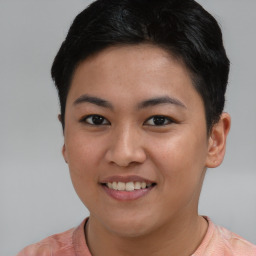 Joyful asian young-adult female with short  brown hair and brown eyes