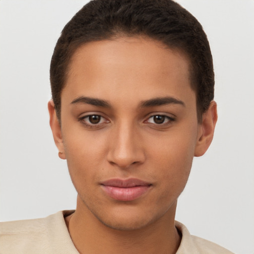 Joyful latino young-adult female with short  brown hair and brown eyes