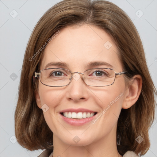 Joyful white adult female with medium  brown hair and blue eyes