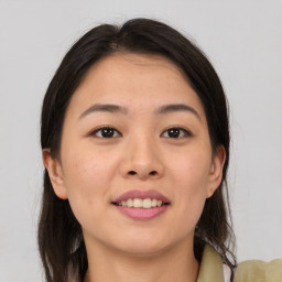 Joyful asian young-adult female with medium  brown hair and brown eyes