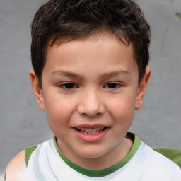 Joyful white child male with short  brown hair and brown eyes