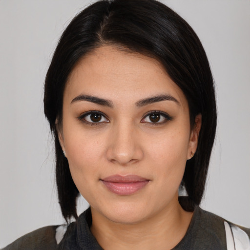 Joyful latino young-adult female with medium  black hair and brown eyes