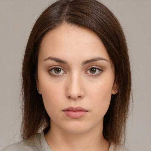 Neutral white young-adult female with medium  brown hair and brown eyes