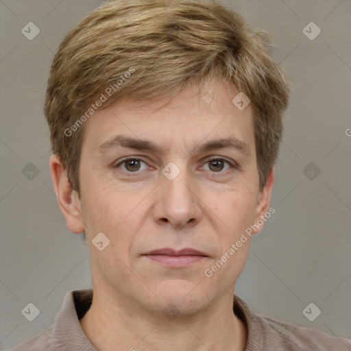 Joyful white adult male with short  brown hair and grey eyes