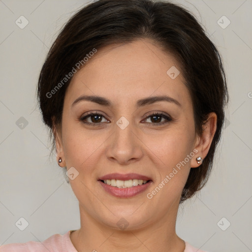 Joyful latino young-adult female with medium  brown hair and brown eyes