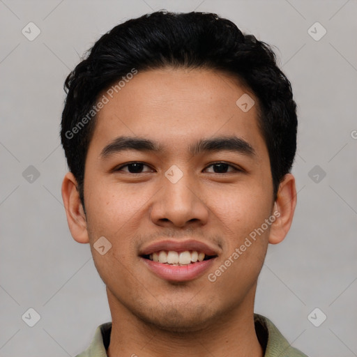 Joyful latino young-adult male with short  black hair and brown eyes