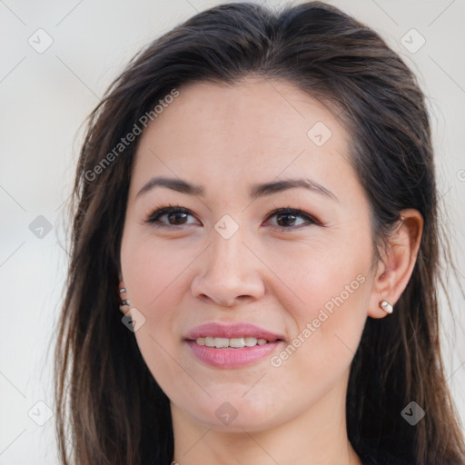 Joyful white young-adult female with long  brown hair and brown eyes