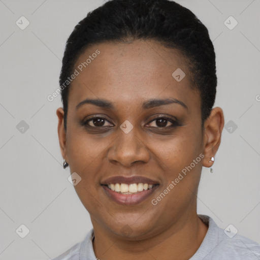 Joyful black young-adult female with short  black hair and brown eyes