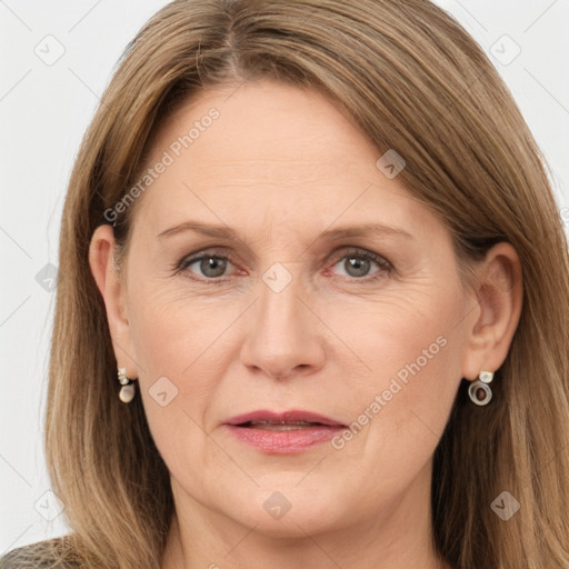 Joyful white adult female with long  brown hair and grey eyes