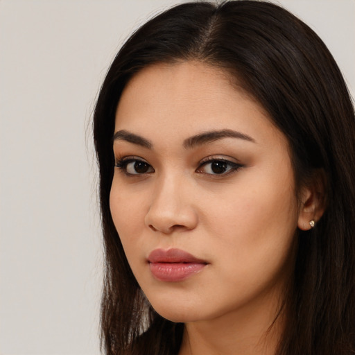 Neutral latino young-adult female with long  black hair and brown eyes