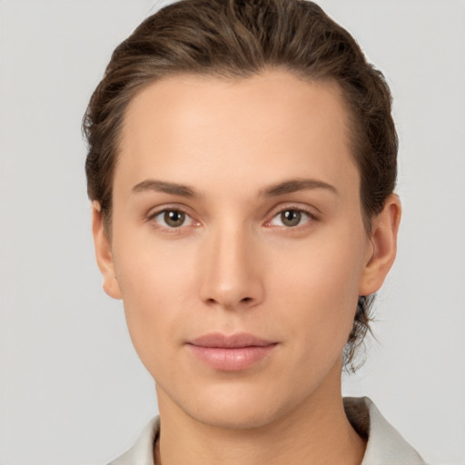 Neutral white young-adult female with short  brown hair and brown eyes