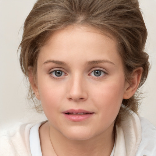 Joyful white child female with medium  brown hair and brown eyes