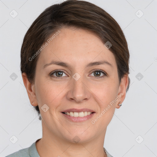 Joyful white young-adult female with short  brown hair and grey eyes