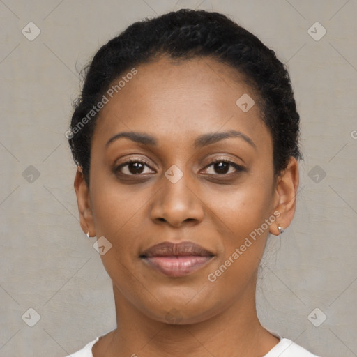 Joyful black young-adult female with short  black hair and brown eyes