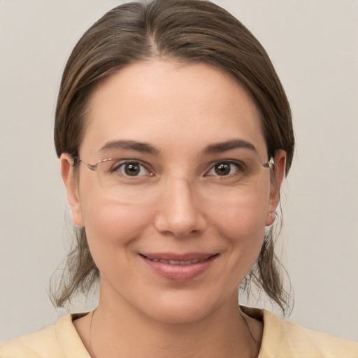 Joyful white young-adult female with medium  brown hair and brown eyes