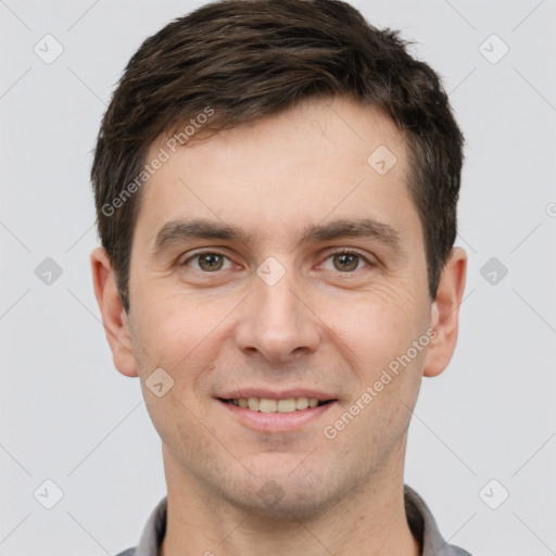 Joyful white young-adult male with short  brown hair and brown eyes