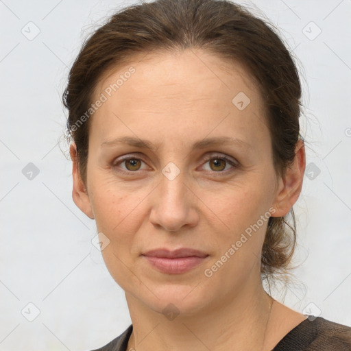 Joyful white adult female with short  brown hair and grey eyes