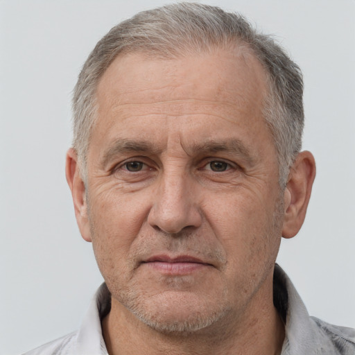 Neutral white middle-aged male with short  gray hair and brown eyes