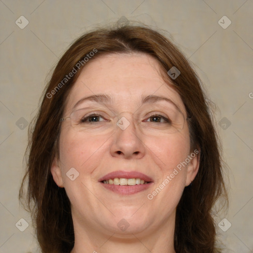 Joyful white adult female with medium  brown hair and brown eyes