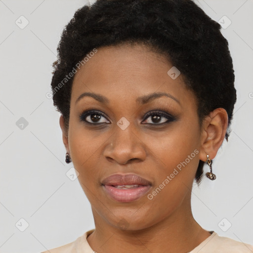 Joyful black young-adult female with short  brown hair and brown eyes