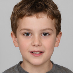 Joyful white child male with short  brown hair and brown eyes