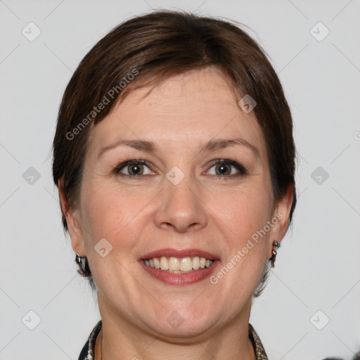 Joyful white adult female with medium  brown hair and grey eyes