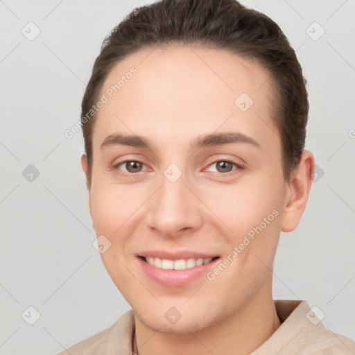 Joyful white young-adult female with short  brown hair and brown eyes