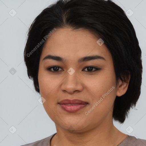 Joyful asian young-adult female with medium  brown hair and brown eyes