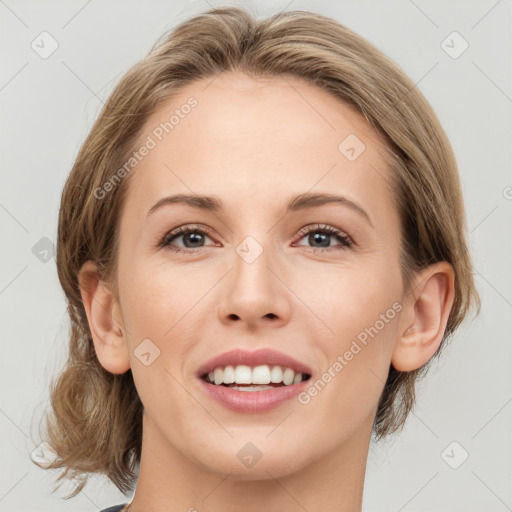 Joyful white young-adult female with medium  brown hair and green eyes