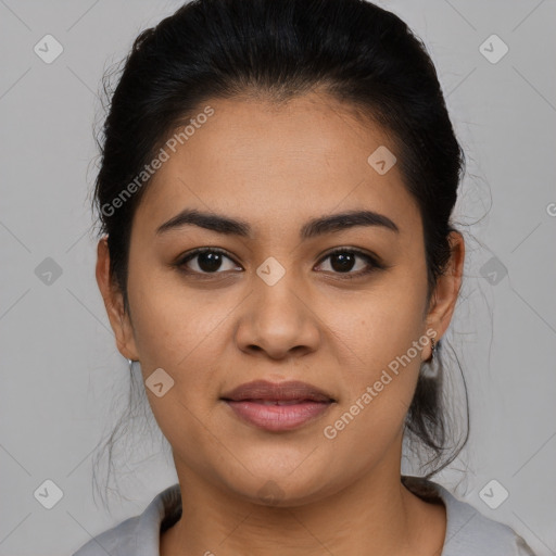 Joyful latino young-adult female with medium  brown hair and brown eyes