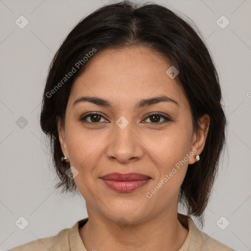 Joyful latino young-adult female with medium  brown hair and brown eyes