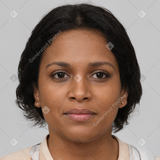 Joyful black young-adult female with medium  brown hair and brown eyes