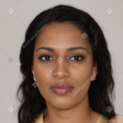 Joyful black young-adult female with long  black hair and brown eyes