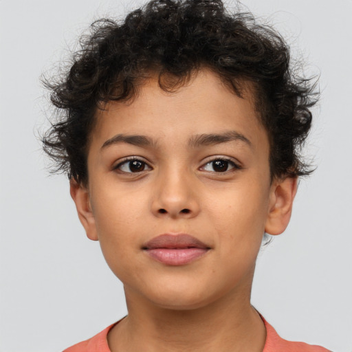 Joyful latino child female with short  brown hair and brown eyes