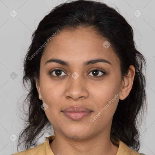 Joyful latino young-adult female with medium  brown hair and brown eyes